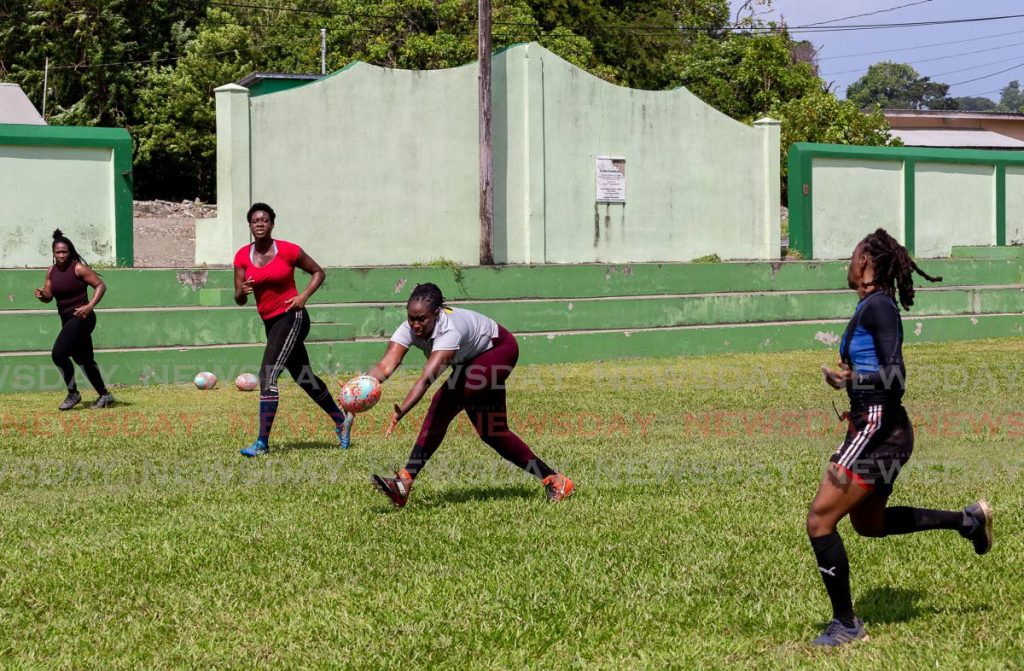 Players go through a drill, during a training session of the Tobago Rugby Football Club, at the Calder Hall recreation field. - David Reid