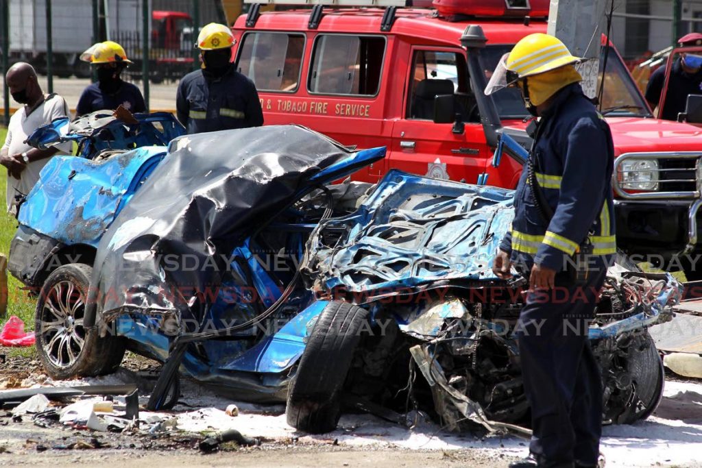 Fire officers at the scene of the accident. Photo by Roger Jacob