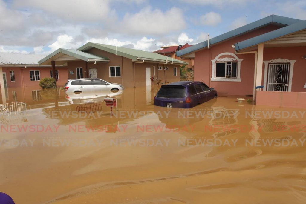 Submerged vehicles following devastating floods at the Greenvale HDC housing development, La Horquetta in October 2018. TT  is vulnerable to rising sea levels, a loss of coastal habitat, increased flooding, and hillside erosion with considerable human and financial impact. - Lincoln Holder