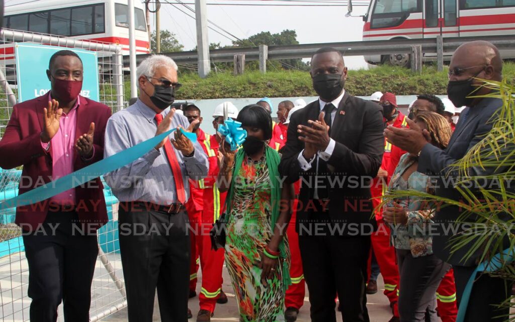 In this file photo, Public Utilities Minister Marvin Gonzales and St Joseph MP Terrence Deyalsingh symbolically open a booster station at Mendez Drive, Champ Fleurs in October. - ROGER JACOB
