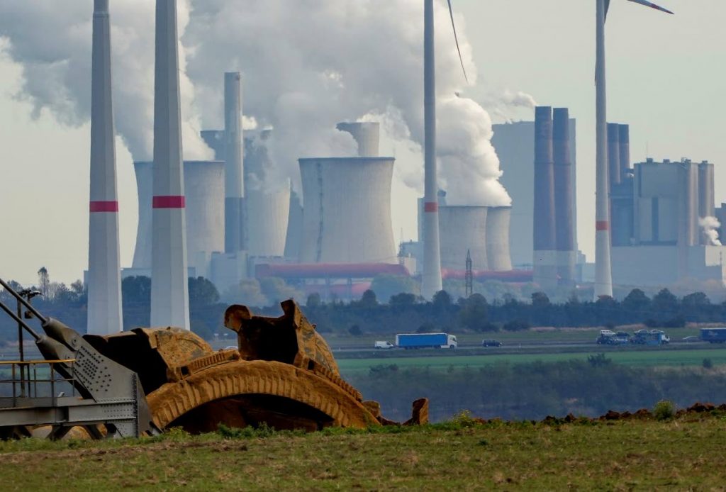 Steam comes out of the chimneys of the coal-fired power station Neurath near the Garzweiler open-cast coal mine in Luetzerath, Germany, on October 25. - AP PHOTO