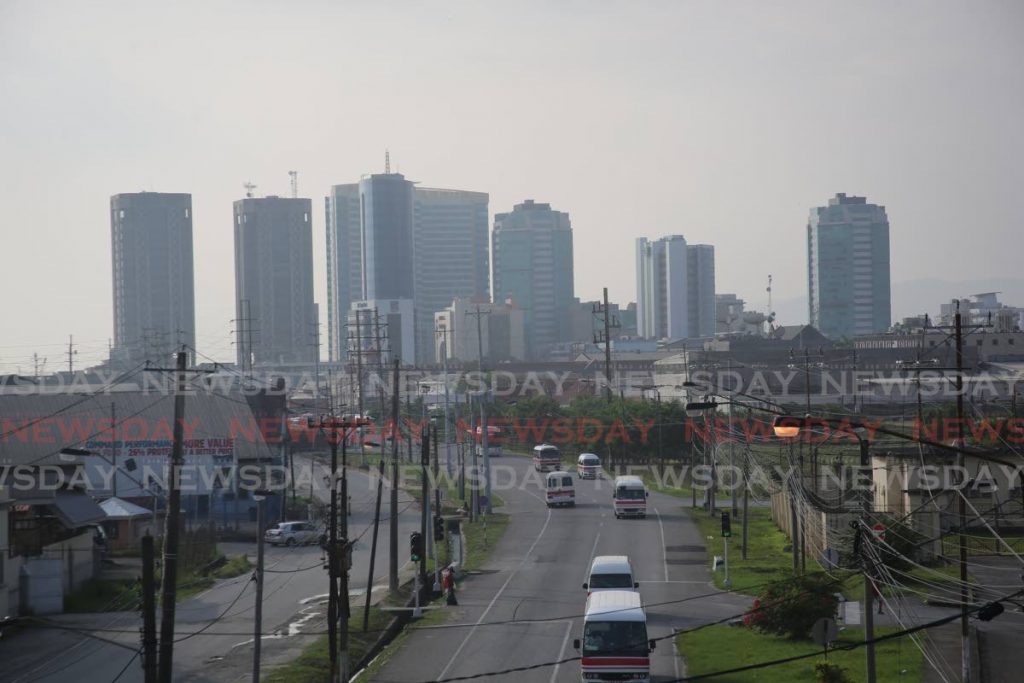 In this photo taken on October 29, Port of Spain is barely visible from the NP flyover through a combination of Saharan dust and ash from the Cumbre Vieja volcano in Spain, reducing the air quality. - Sureash Cholai