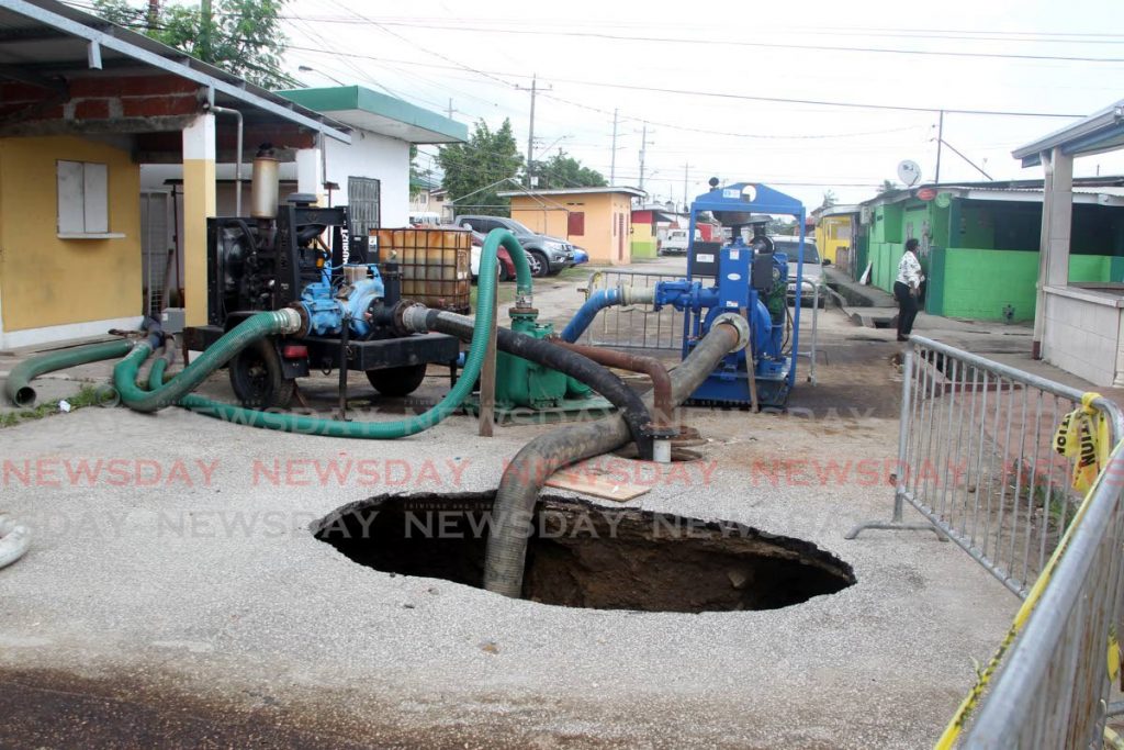 Work on the sinkhole caused by a leaking sewer line in Beetham Gardens which is ongoing and which WASA estimates should be completed by December 2. FILE PHOTO - 