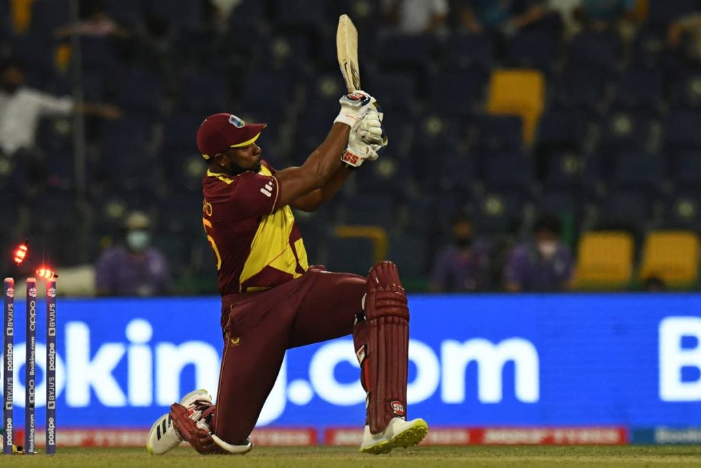 West Indies' captain Kieron Pollard is bowled by Sri Lanka's Wanindu Hasaranga de Silva (not pictured) during the ICC Twenty20 World Cup match between West Indies and Sri Lanka at the Sheikh Zayed Cricket Stadium in Abu Dhabi, UAE on Thursday. (AFP PHOTO) - 