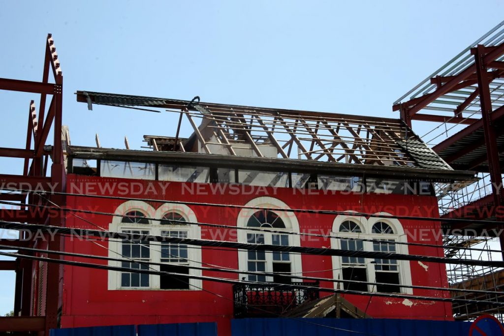  PNM headquarters, Balisier House,  is left exposed to the elements after its roof was removed with no covering to replace it. A new steel-dramed building is being constructed on its grounds  at Tranquillity Street, Port of Spain. Photo by Sureash Cholai