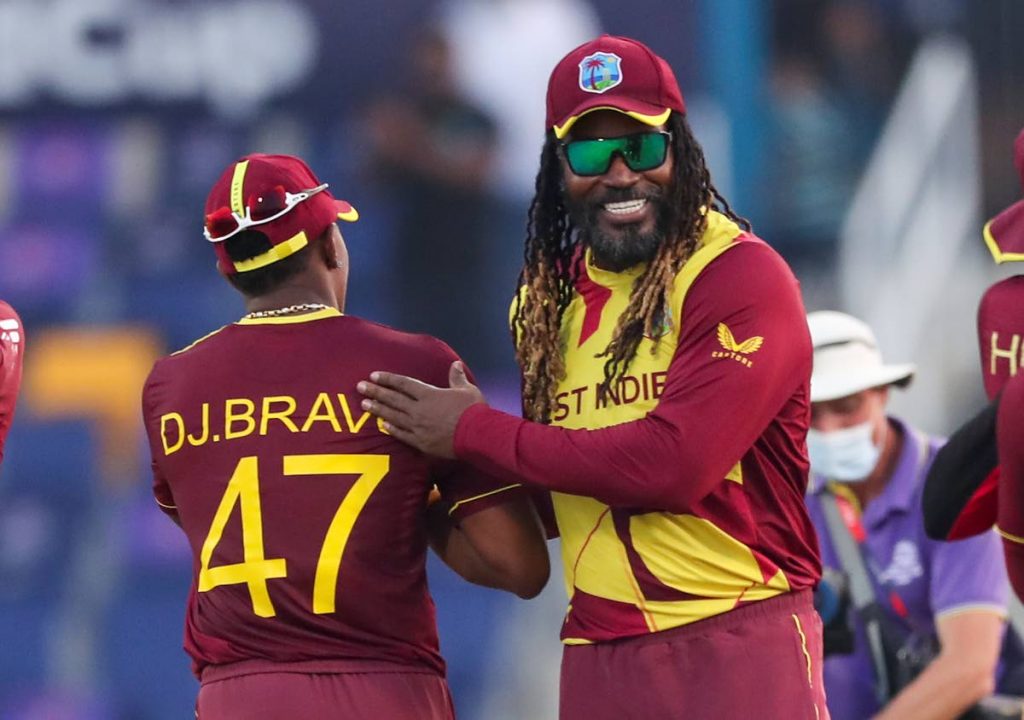 West Indies’ Chris Gayle, right, and teammate Dwayne Bravo embrace following their ICC Twenty20 World Cup match against Australia in Abu Dhabi, UAE, on Saturday.  - 
