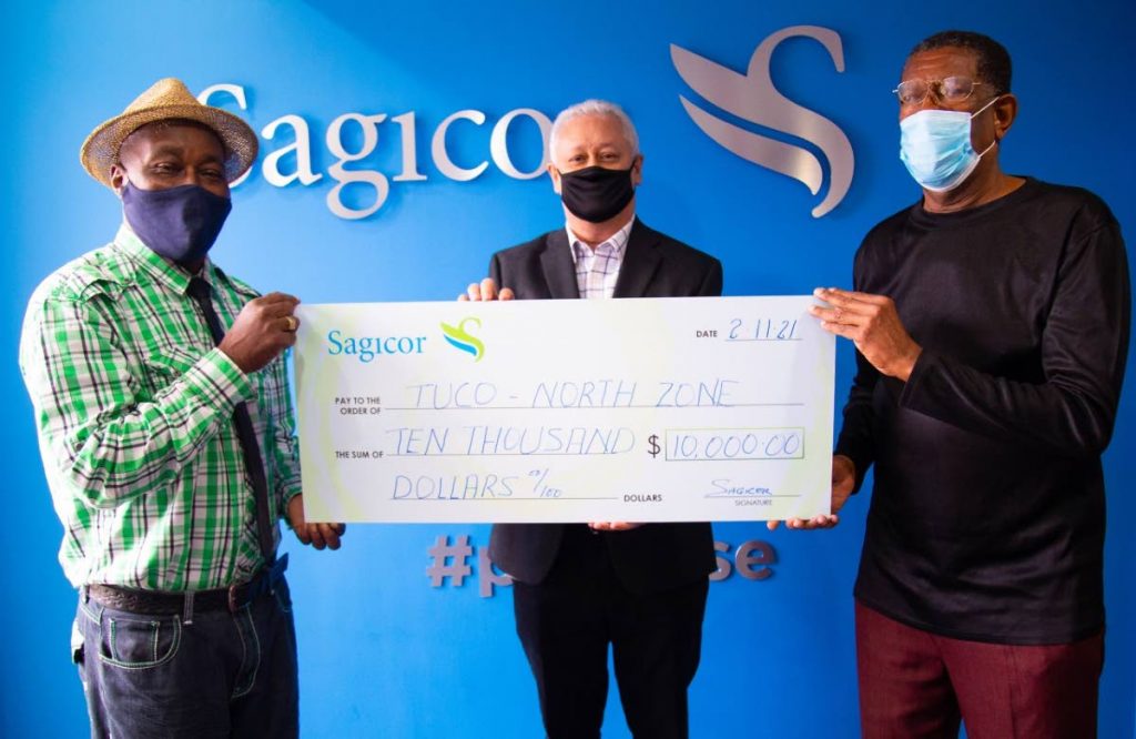  For the artform! Sagicor’s vice president, sales and marketing Jacinto Martinez, presents a sponsorship cheque to Phillip “Black Sage” Murray (left) and Mark “Contender” John (right) in support of Extemporama. - 