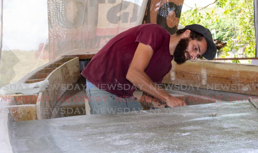 Lambeau native Joel Hart builds a pirogue for a customer at Belle Garden Bay Road, Tobago recently. - David Reid