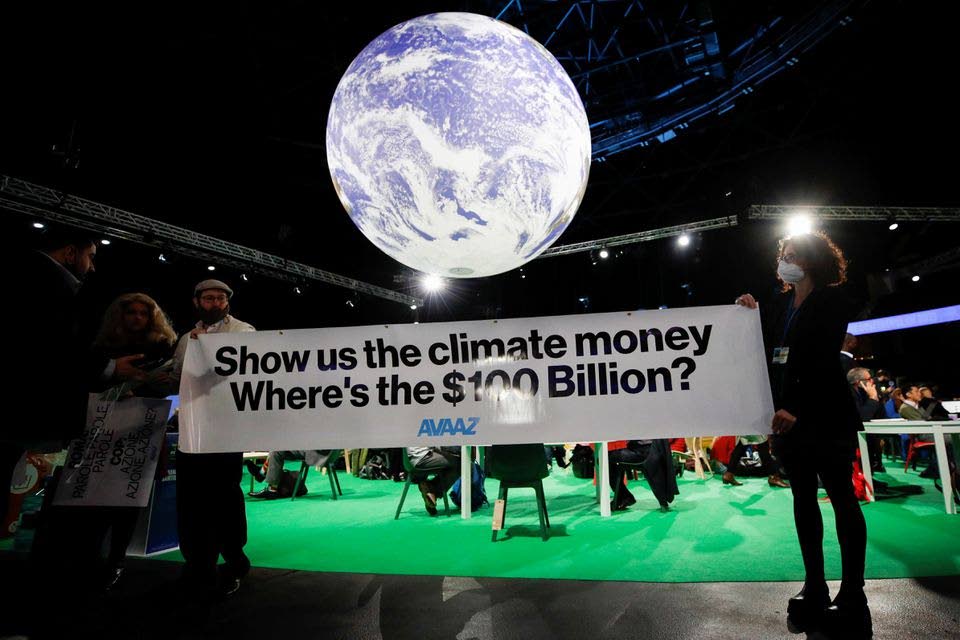 Activists hold a sign during the UN Climate Change Conference (COP26), in Glasgow, Scotland, on November 5. At the COP26 climate change conference in Glasgow, Scotland, the IFRS Foundation announced three important measures aimed at improved governance and investment decision making.  - Photo taken from indyturk.com