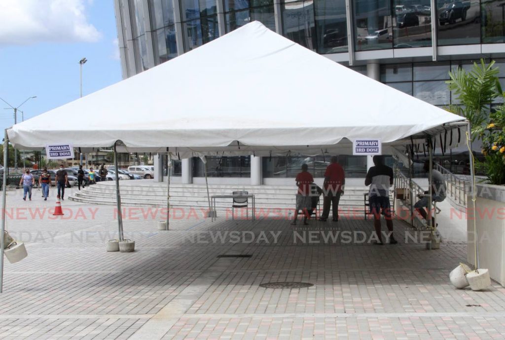 The tent designated for people wanting their 3rd dose of the covid19 vaccine at the Southern Academy for the Performing Arts, San Fernando on Thursday, had a very slow turn out on the first day.  - Photo by Angelo Marcelle