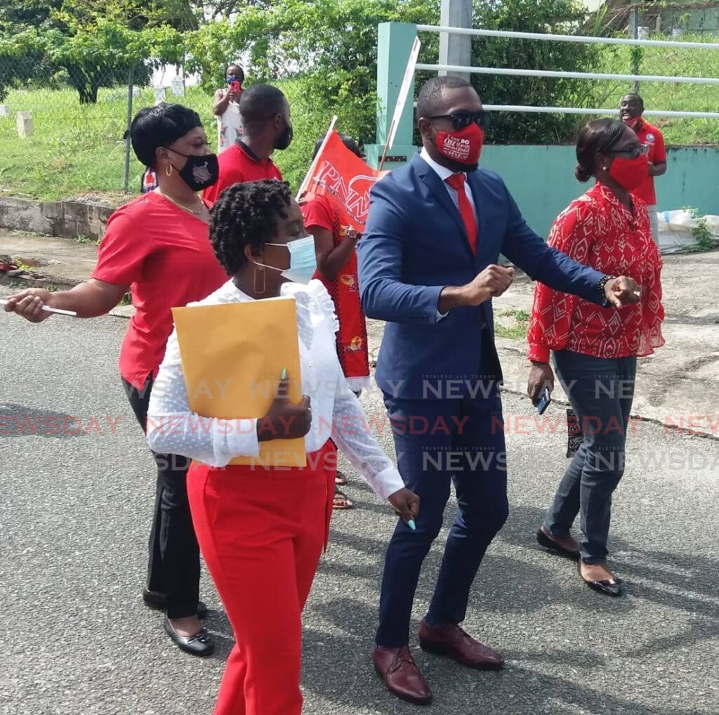 PNM candidate for Darrel Spring/Whim Kelvon Morris dances his way to Tam Building, Glen Road, Scarborough to file his nomination papers on Monday. - 