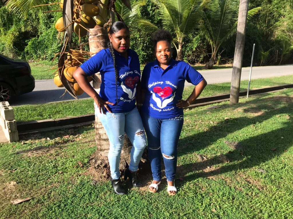 On November 5, Camille Nicholas (left) and her friend Faith Dove (right) drove around Kernahan Village in Manzanilla and randomly distributed tablets to four underprivileged children. - Camille Nicholas