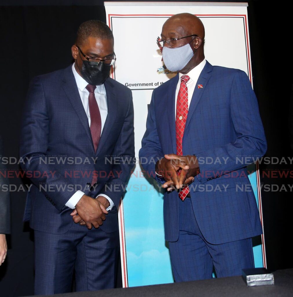 Prime Minister Dr Keith Rowley, right, Eugene Okpere, Shell's vice president and country chair at signing of the Manatee production sharing contract, Hyatt Regency, Port of Spain on Wednesday. - PHOTO BY SUREASH CHOLAI
