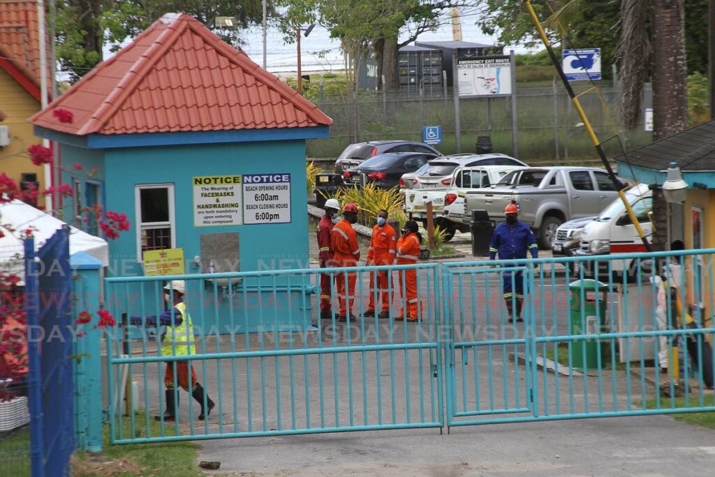 In this November 17 file photo, workers of Heritage Petroleum Company Limited were at the Vessigny Beach tending to an oil leak at the Vessigny river. - Photo by Marvin Hamilton