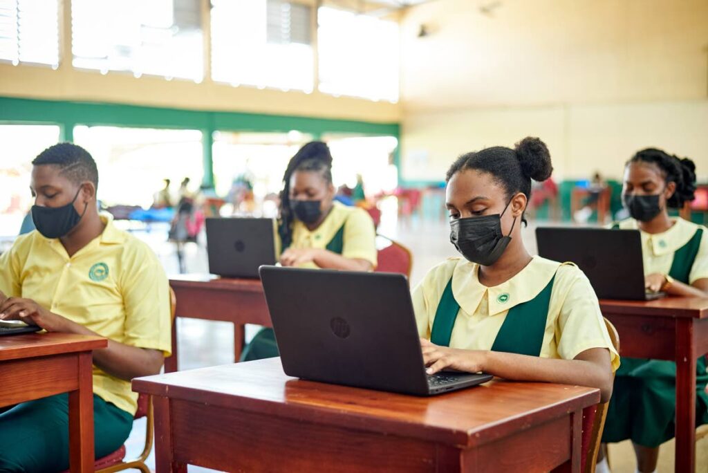 ONLINE: Signal Hill Secondary school students with laptops provided by the Scotiabank Foundation in collaboration with the Yahweh Foundation in Tobago. PHOTO COURTESY SCOTIABANK 