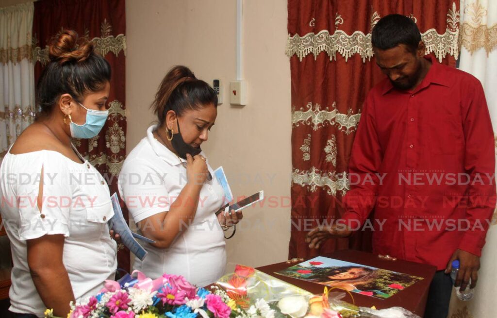 Relatives of Rehana Jaggernath, at her funeral at Clark and Battoo's Chapel, Montrose, Chaguanas on Saturday.  - Angelo Marcelle