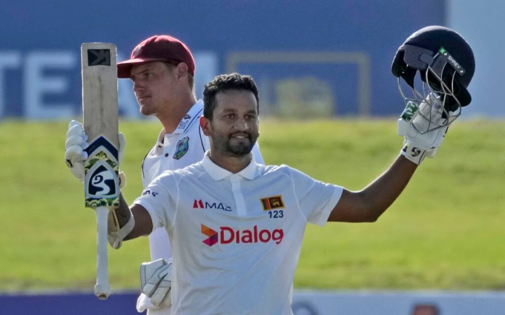 Sri Lankan captain Dimuth Karunaratne celebrates scoring a century during the day one of the first test cricket match between Sri Lanka and West Indies' in Galle, Sri Lanka, Sunday, Nov. 21, 2021. (AP Photo) 