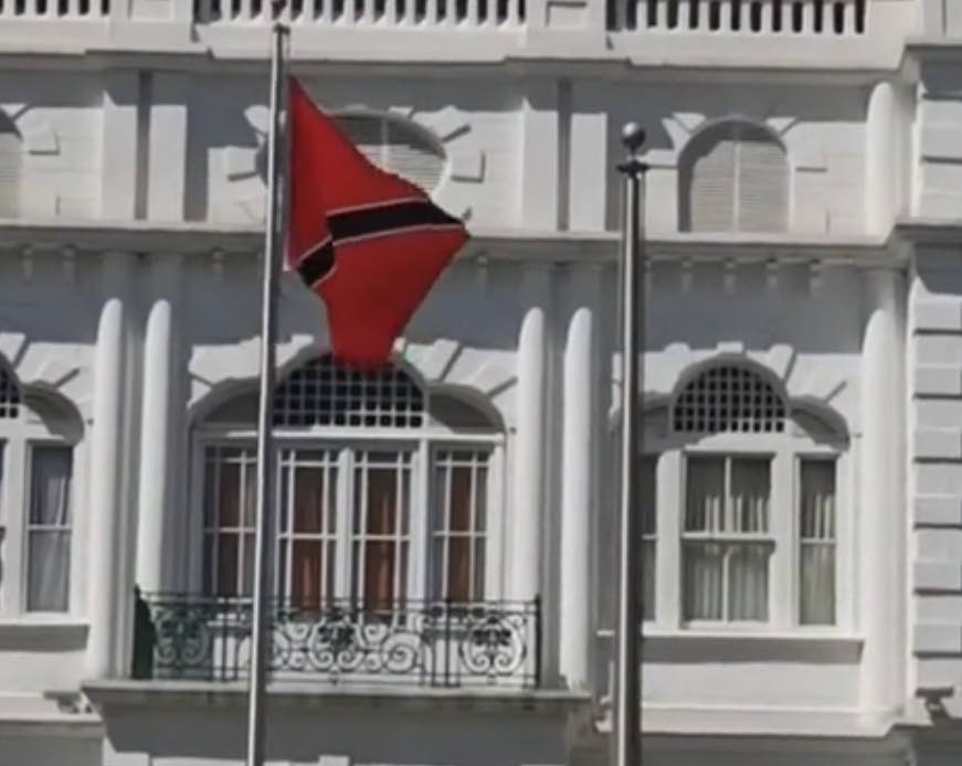 TT flag flying upside down outside white hall Port of Spain on November 22 - 