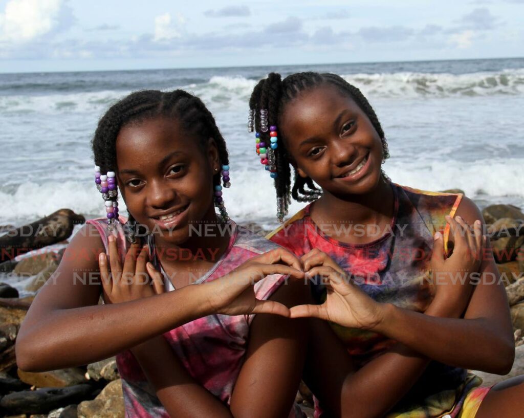 Jenique, left, and Jenniah Mc Laren share a deep love as twin sisters. - PHOTO BY AYANNA KINSALE