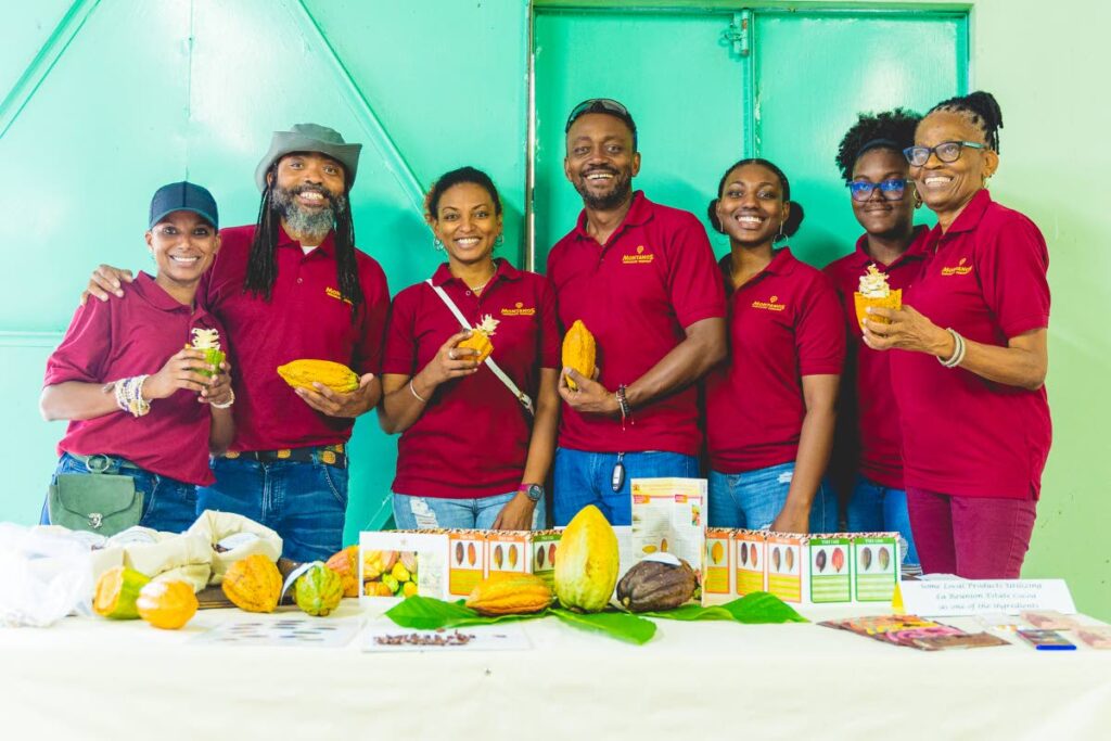 The Montano family: (From left) Renee, Machel, Elesha, Marcus, Marley, Micha and Elizabeth, with the cocoa-based products made by the Montano Chocolate Co Ltd (MCCL). Photo courtesy NH Productions and MCCL.  