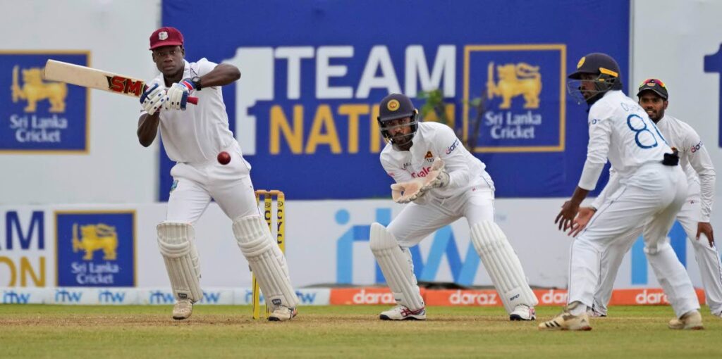 West Indies batsman Nkrumah Bonner (left) plays a shot as Sri Lankan wicketkeeper Dinesh Chandimal (second from left) watches during the fifth day of their first Test in Galle, Sri Lanka, on Thursday. - AP photo