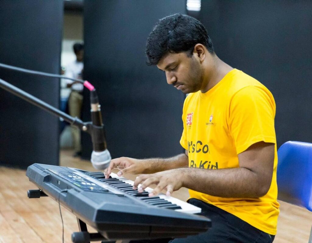 Navin Rampaul plays a classical piece at an autism event.  - Sataish Rampersad
