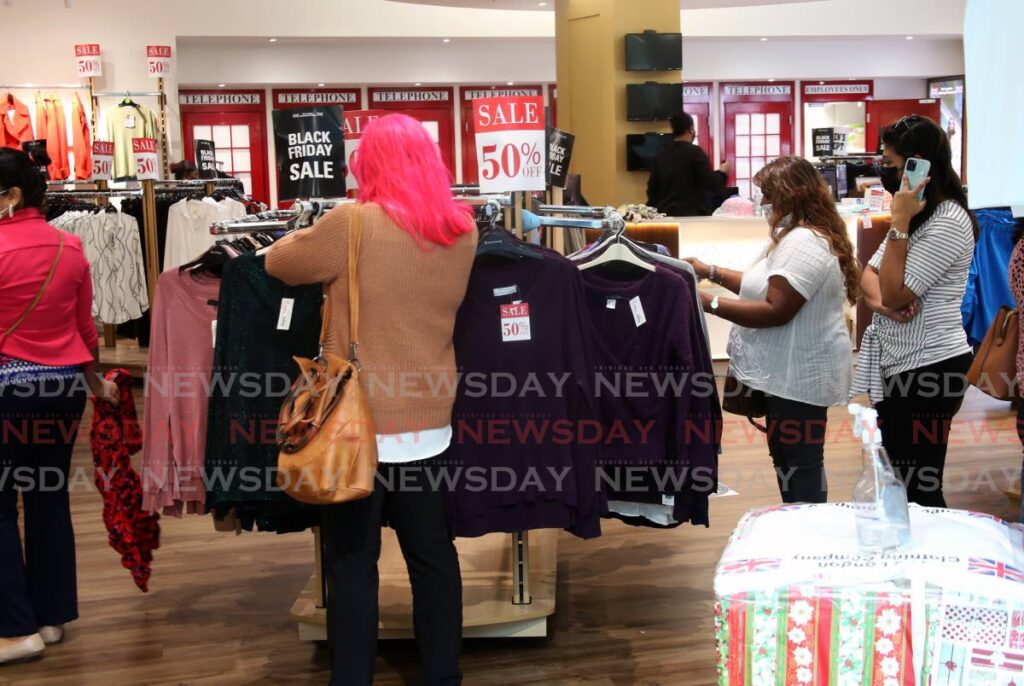 Shoppers taking advantage of Black Friday sales at the Falls, West Mall a day after the prime minister addressed the nation and warned that TT's health system is hovering dangerously to collapse due to rising covid19 infections. PHOTO BY SUREASH CHOLAI - 