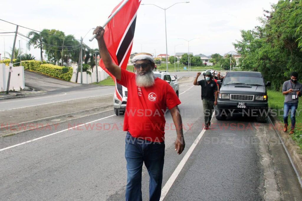  First Wave Movement activist Umar took to the streets to march from south Trinidad to Port of Spain. Photo by Lincoln Holder 
