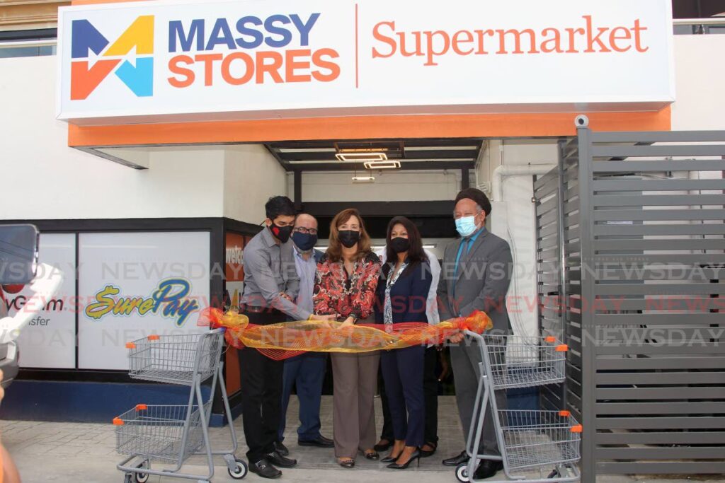From left, landlord of the Highway Plaza, Deepak Lall, chairman of Massy stores David Alfonso, assistant VP of property development, integrated retail porfolio Tisha Maharaj and Henry Awong chairman of the Couva/Tabaquite/Talparo regional corporation cut the ribbon to open the newest  Massy stores supermarket at Highway Plaza, Freeport. - Photo by Lincoln Holder