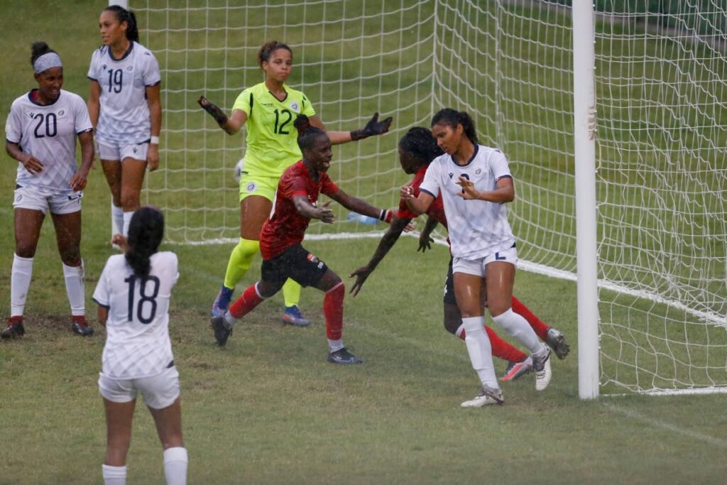 Trinidad and Tobago's Kennya Cordner (3rd right) congratulates teammate Rhea Belgrave (2nd right) after Belgrave scored against the Dominican Republic, during the international football friendly, at San Cristobal, Dominican Republic, on Tuesday. - via TTFA Media