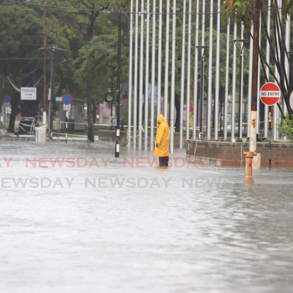 Several streets in Port of Spain were flooded with the sudden deluge of rain shortly before noon.

Photos by Jeff K Mayers