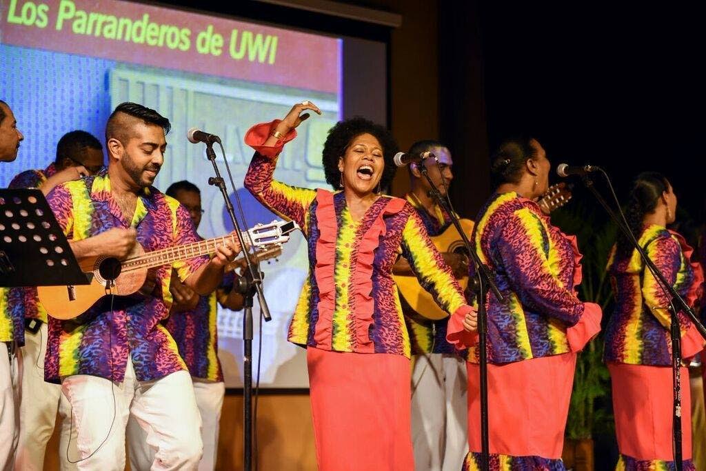 Joanne Briggs singing with other members of Los Parranderos de UWI at the band’s 35th anniversary concert at the Learning Resource Centre, UWI, St Augustine. Photo courtesy Joanne Briggs - 