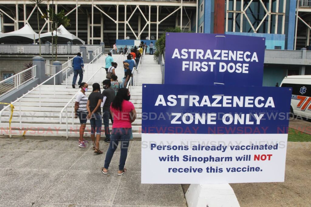 People line up at the Ato Boldon Stadium to get their AstraZeneca vaccine.  (FILE PHOTO) - 