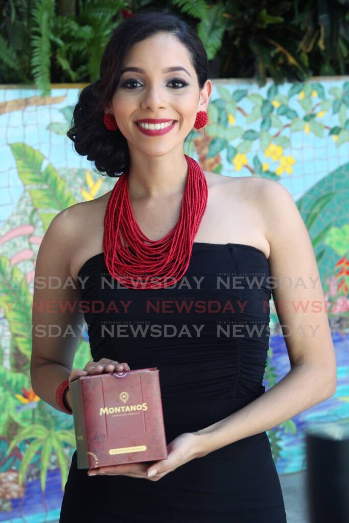Miss World TT delegate Jeanine Brandt holds one of the gifted boxes of Montanos chocolates for Miss World contestants.  The competition in Puerto Rico has been postponed for three months owing to an outbreak of covid19. - File photo/Lincoln Holder