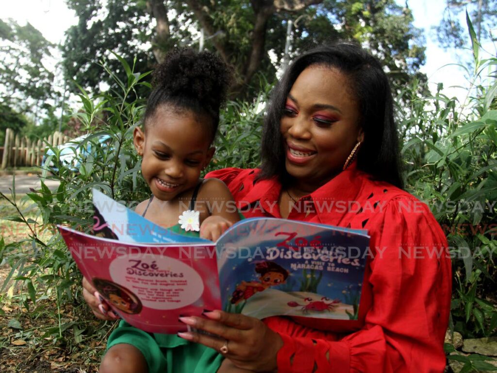 Liseanne Martin-Subero reads to her daughter Zoe from her children's book Zoe the Fairy's Discoveries. - PHOTO BY AYANNA KINSALE
