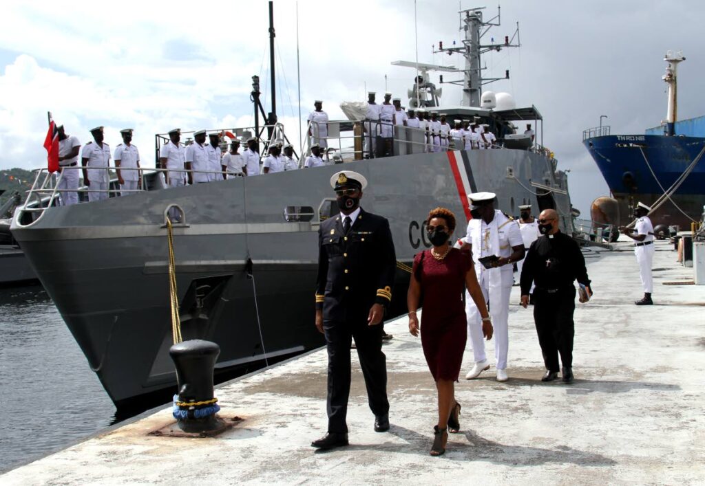 Lieutenant commander Torino Tracey and Shellanne Archer leave the TTS Scarborough (CG 42) vessel after it was commissioned at Staubles Bay, Chaguaramas, Sunday. - Ayanna Kinsale