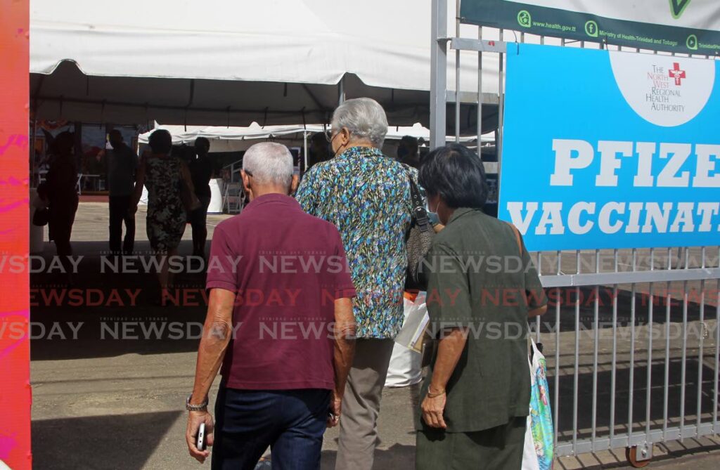 People arrive to receive the Pfizer vaccine at the Paddock vaccination site, Queen's Park Savannah on November 29. - FILE PHOTO/ROGER JACOB