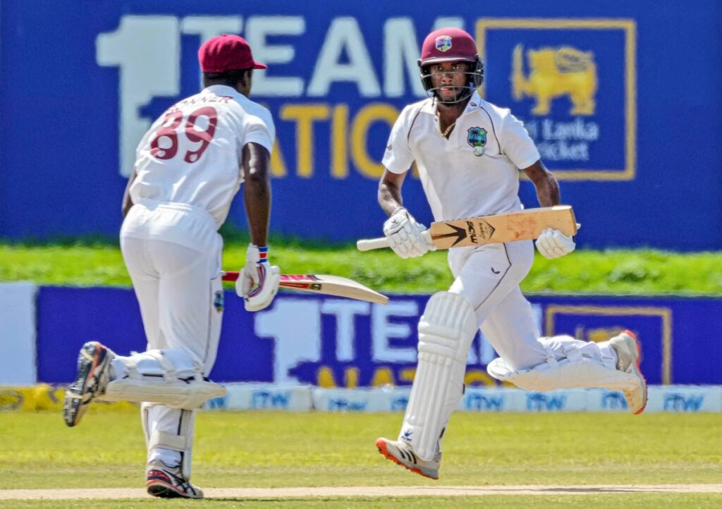 West Indies batsmen Nkrumah Bonner, left, and captain Kraigg Brathwaite run between wickets during day three of the second Test against Sri Lanka in Galle, Sri Lanka, on Wednesday. (AP Photo) - 
