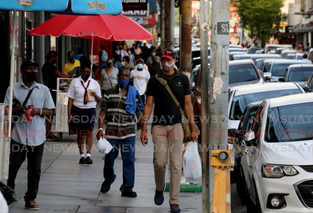 In this file photo, people on the move on Frederick Street, Port of Spain. Photo by Sureash Cholai