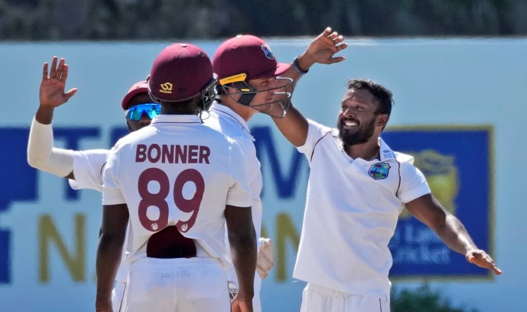 West Indies bowler Veerasammy Permaul, right, celebrates taking the wicket of Sri Lankan batsman Charith Asalanka during the fourth day of their second Test in Galle, Sri Lanka, on Thursday. (AP PHOTO) 