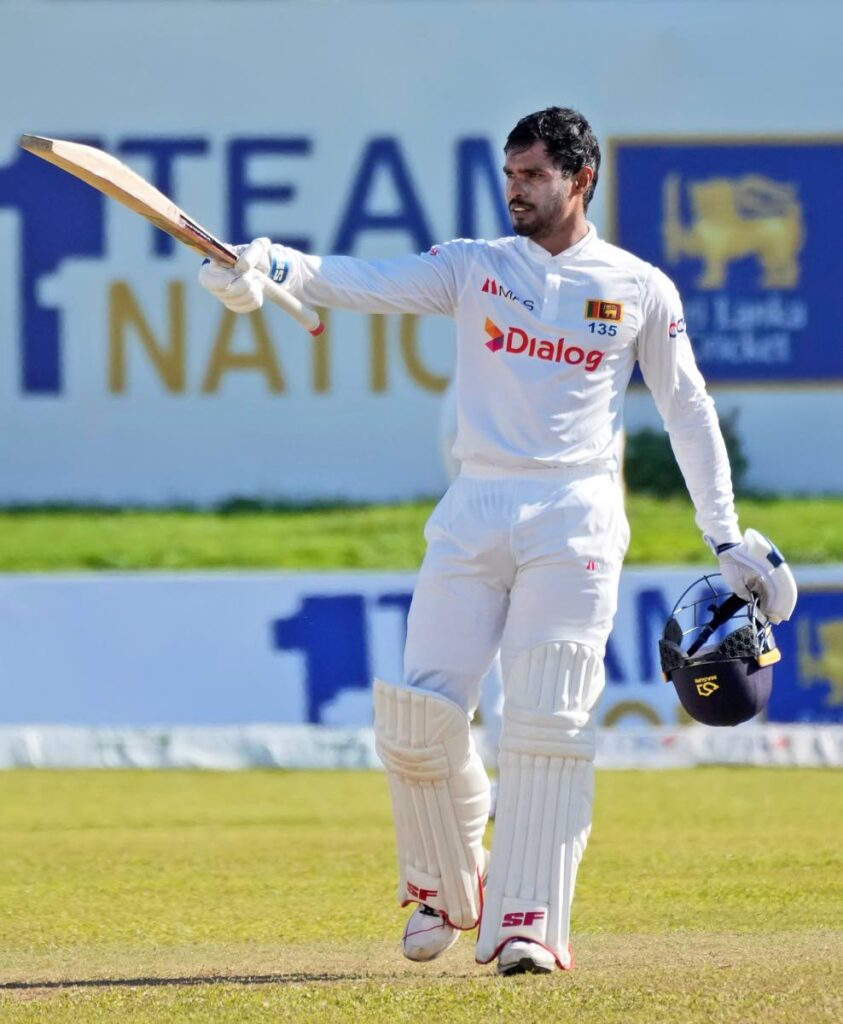 Sri Lankan batsman Dhananjaya de Silva celebrates scoring a century against West Indies during the fourth day of the second Test in Galle, Sri Lanka, on Thursday. (AP Photo) - 