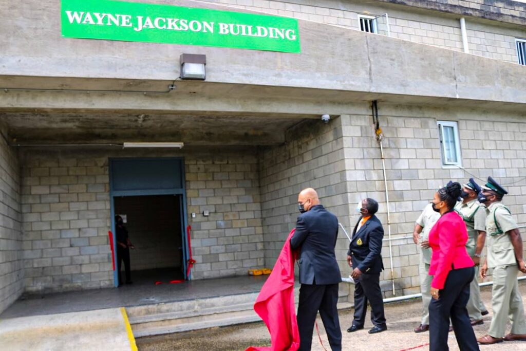 FILE PHOTO: T&T Prison Service Commissioner Dennis Pulchan unveils the new Wayne Jackson Building sign renaming Building 13 at the Maximum Security Prison, Arouca, on July 24. Jackson, who was murdered in 2018, was an acting superintendant in the prison service at the time. - T&T Prison Service