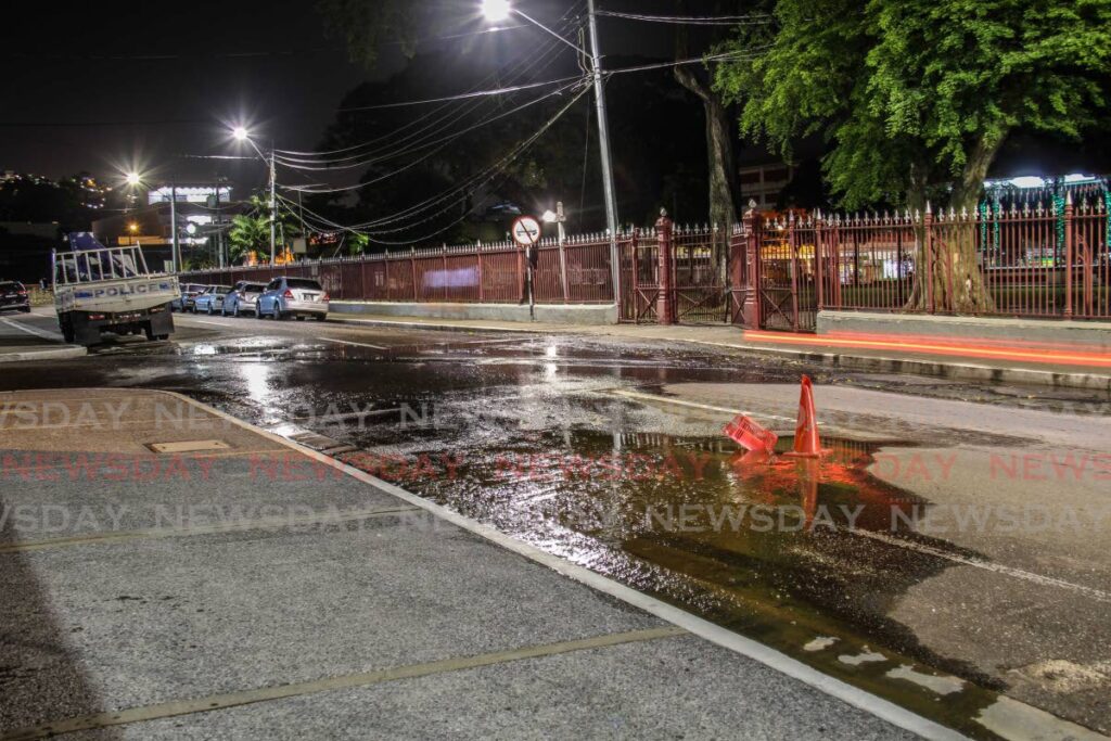 Sewage spills onto the road on Knox Street, Port of Spain, near City Hall on Thursday. - Jeff K. Mayers 