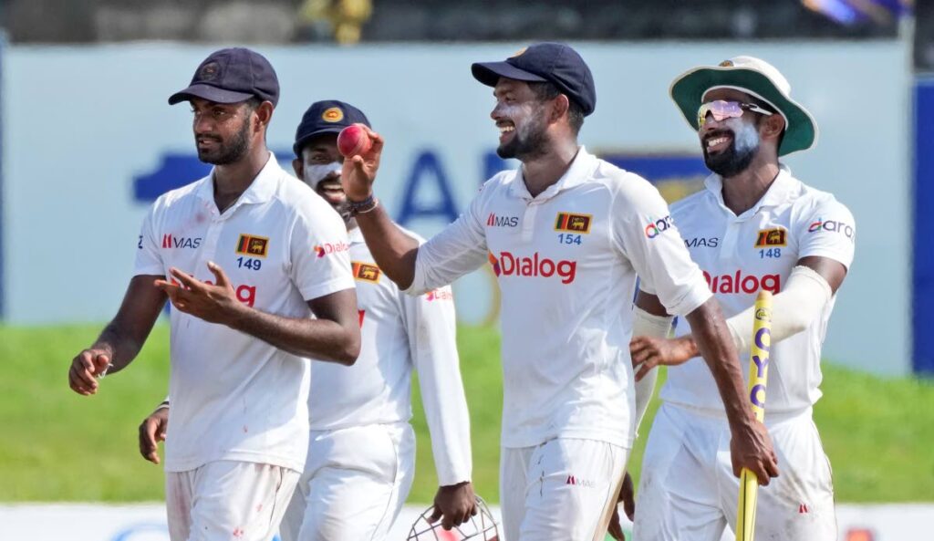 Sri Lankan cricketers from left to right Lasith Embuldeniya, Charith Asalanka, Ramesh Mendis and Chamika Karunaratne celebrate their 164-run victory over West Indies in the second Test in Galle, Sri Lanka, on Friday. (AP PHOTO) - 