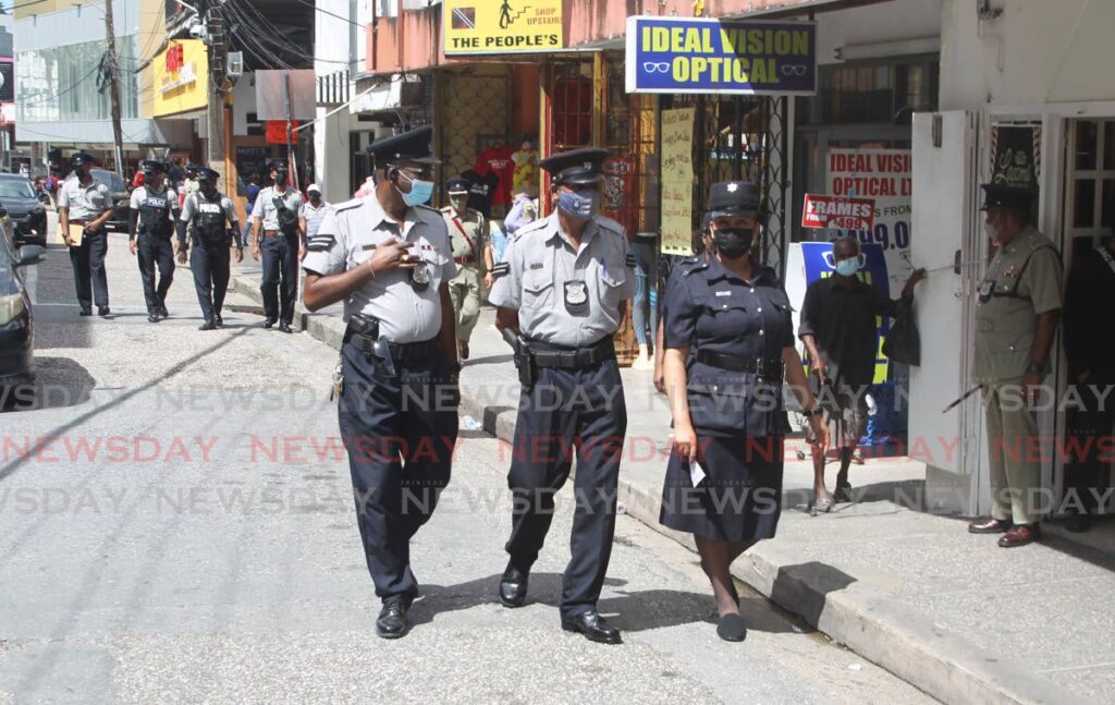 Police patrol in San Fernando on Friday. Photo by Roger Jacob.