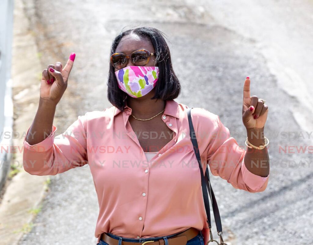 PNM Tobago Council leader and PNM candidate for Signal Hill/Patience Hill Tracy Davidson-Celestine walks to the media after voting in Delaford on Monday. - Photo by David Reid