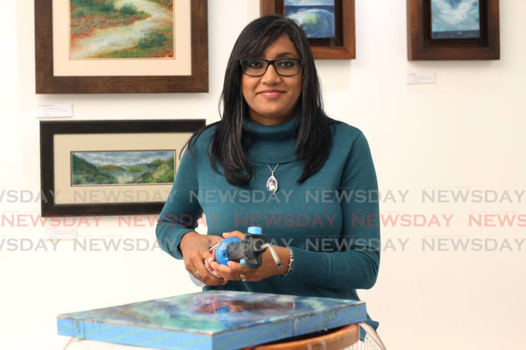 Alicia Nathai-Achong gave up banking to teach herself how to do encaustic paintings. - PHOTO BY MARVIN HAMILTON