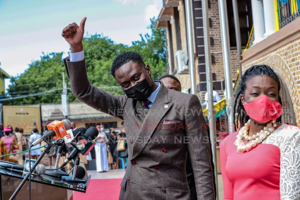 THANK YOU: Newly-sworn Chief Secretary Farley Augustine acknowledges supporters after he took the oath of office at the Assembly Legislature in Scarborough, Tobago on Thursday. With him is councillor Tashia Burris. - Jeff K. Mayers 