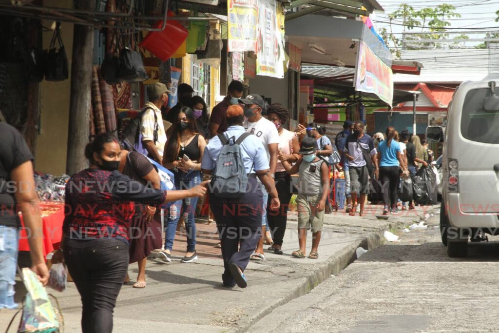 People shop in Princes Town on Friday. - Marvin Hamilton