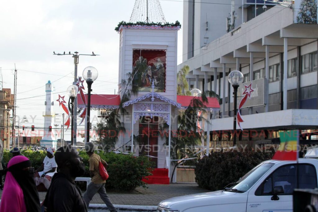 Trade unions want the city officials to remove the Christmas decoration built over the statue of capt Arthur Cirpriani on Independence Square, Port of Spain. - Angelo Marcelle